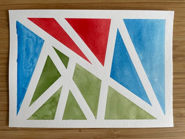 a watercolor painting of red, blue and green triangles